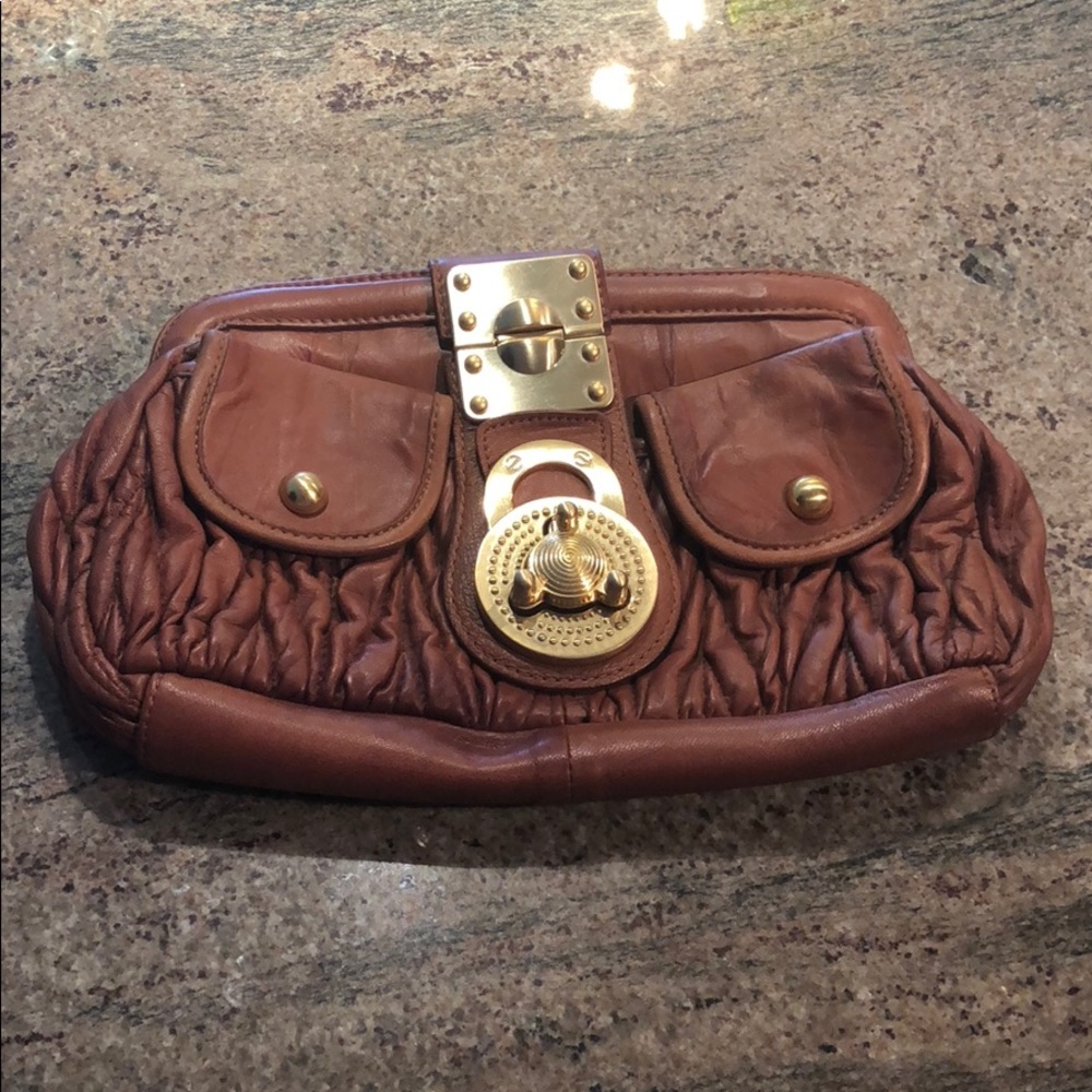 Brown and gold leather clutch